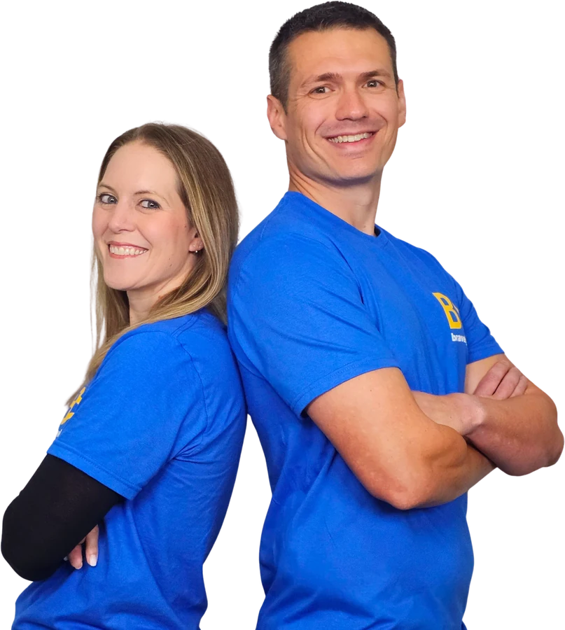 Katy and Jeff Schiesser, founders of Bravely Studios, standing back to back